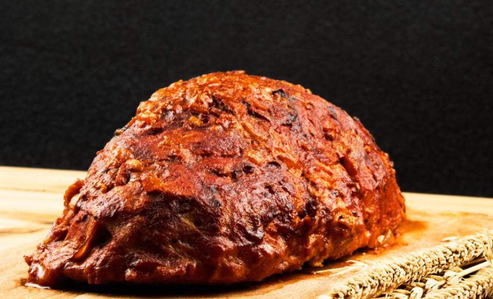 https://www.istockphoto.com/photo/classic-meatloaf-on-a-cutting-board-on-a-wooden-background-in-the-background-are-red-gm1259206063-369051176