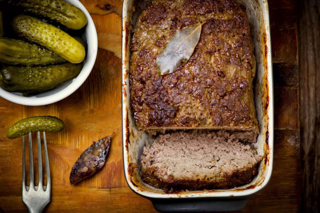 Is it better to bake meatloaf on a sheet pan or loaf pan