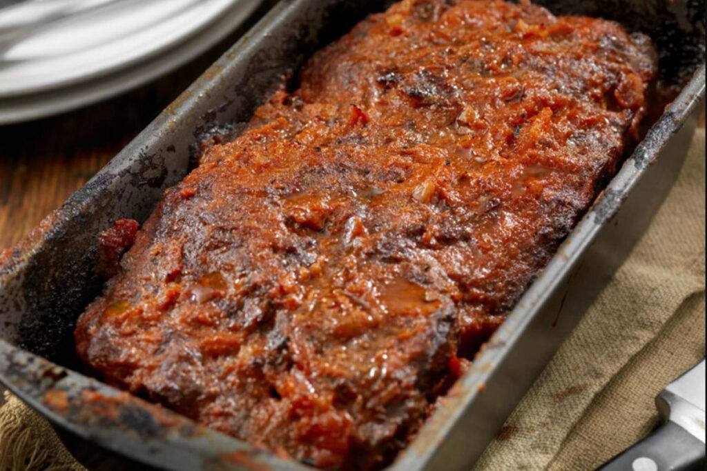 Is it better to bake meatloaf on a sheet pan or loaf pan